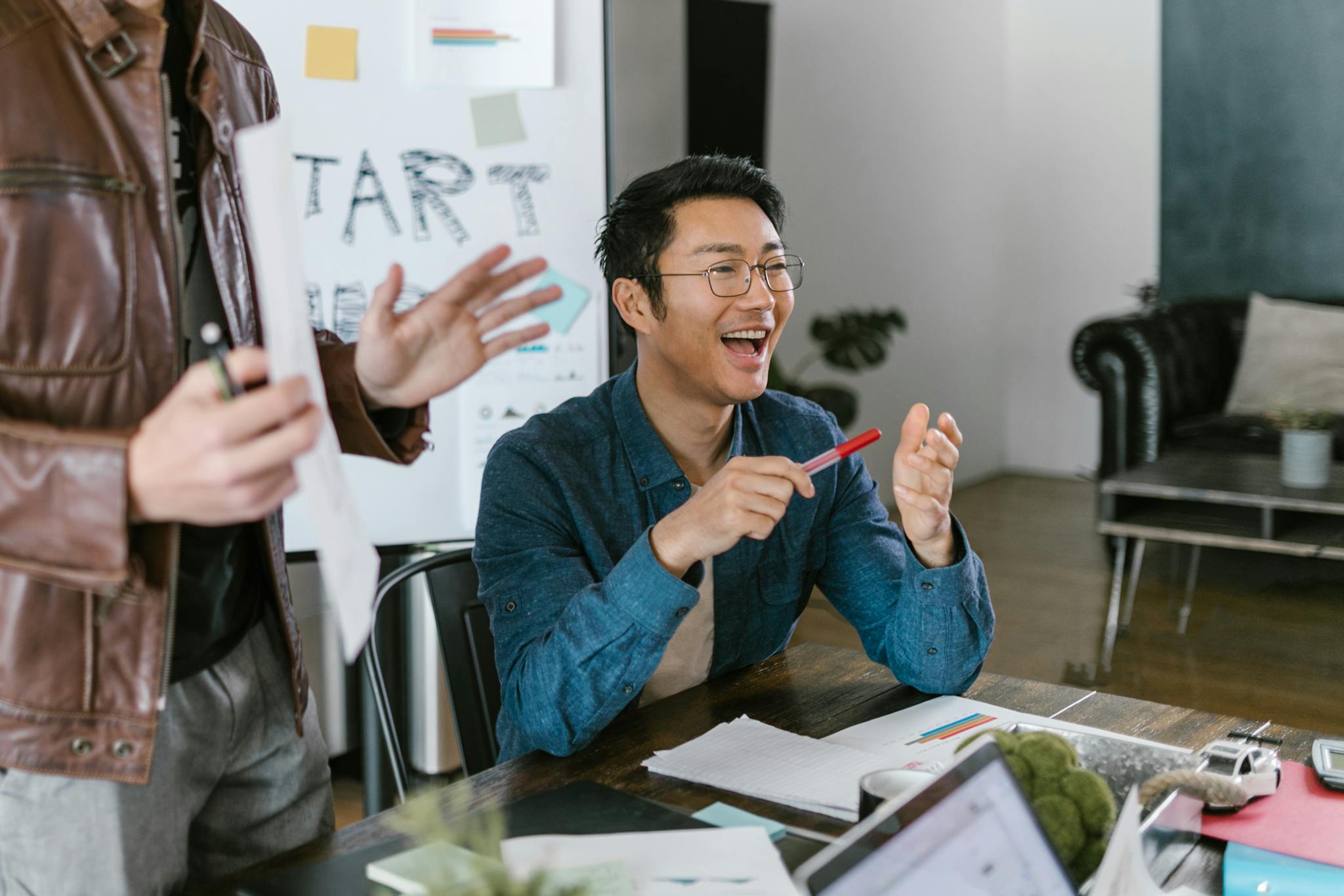Engaged Team Members In A Lively Office